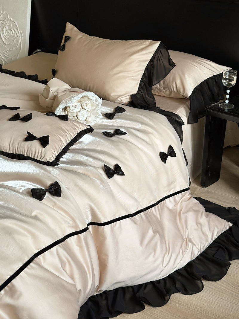 Elegant bedding set made of cotton satin with attached bows and ruffles
