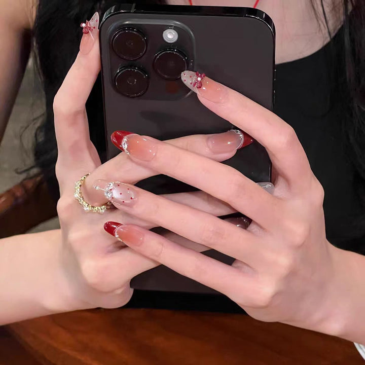 Artificial nails with glitter and tip accents Kalsten