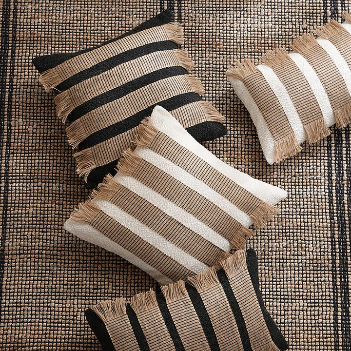 Rectangular decorative cushion with fringes and woven stripes