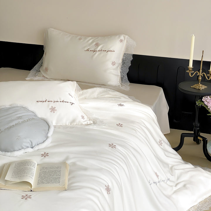 Luxurious satin bedding set with lace trim and snowflake embroidery
