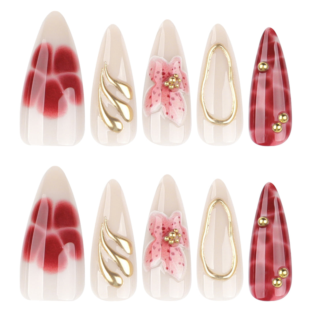 Artful stiletto nails with elegant floral designs and glitter accents Kalsten