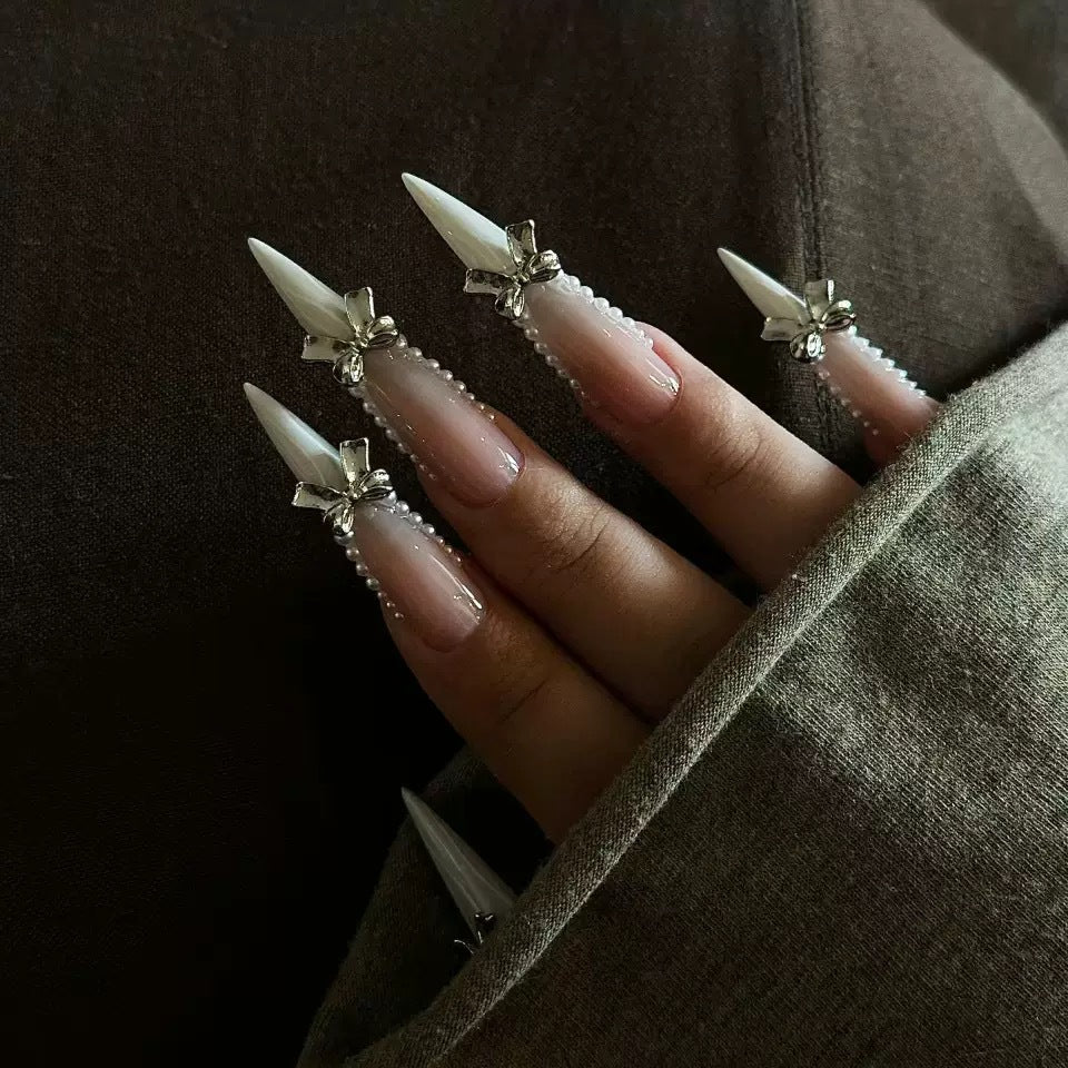 Elegant artificial nail set with 3D rhinestone details and pointed accents Kalsten