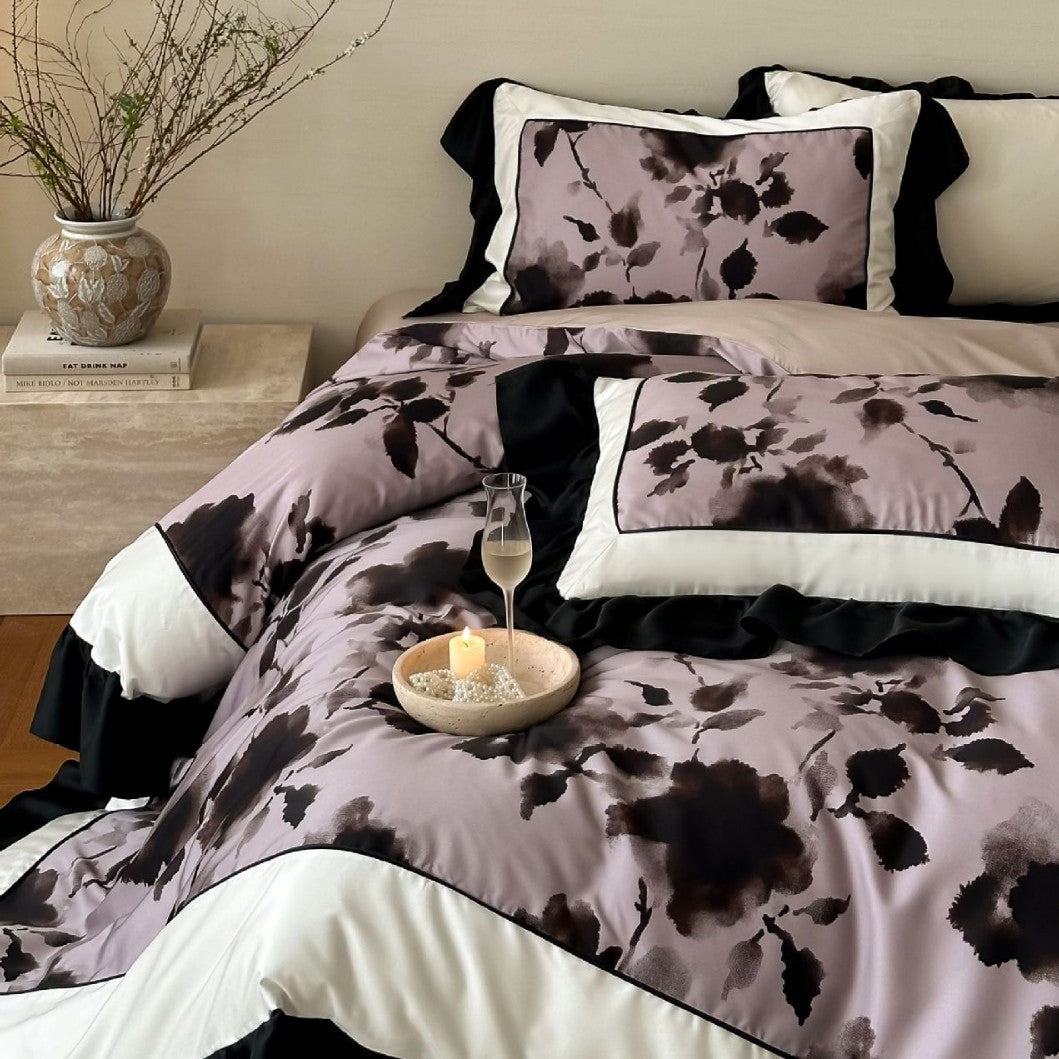 Satin bedding set with watercolored floral print, contrasting piping and flowing ruffles