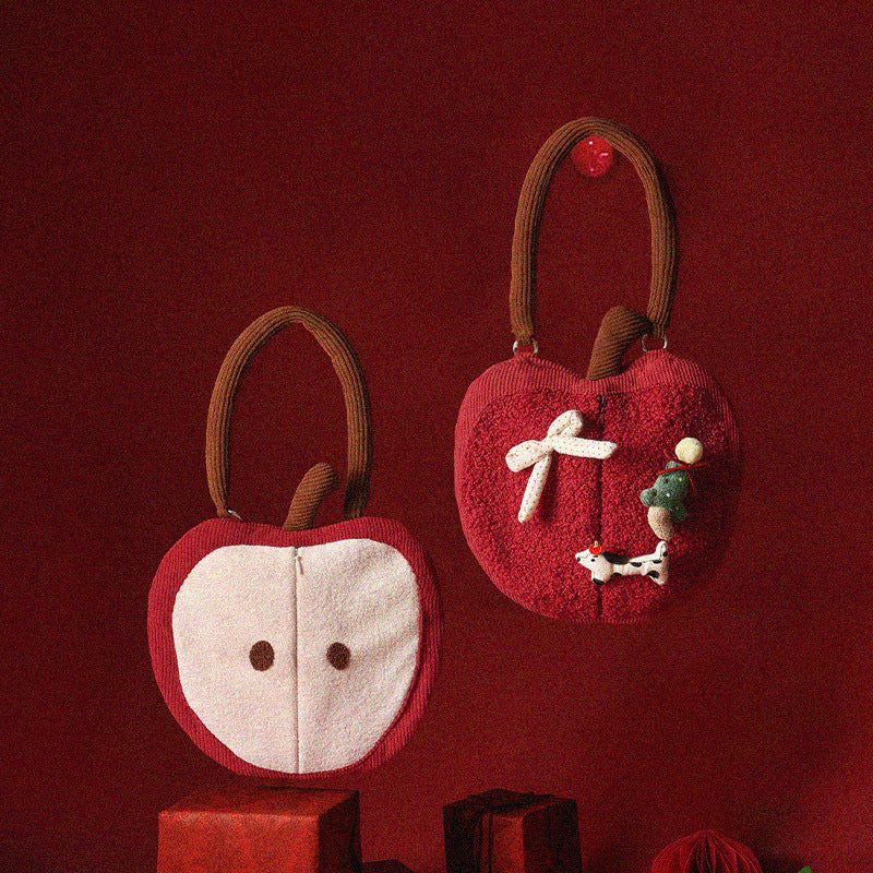 Wall-mounted handkerchief bag in apple shape with handle, plush applications and opening for tissues