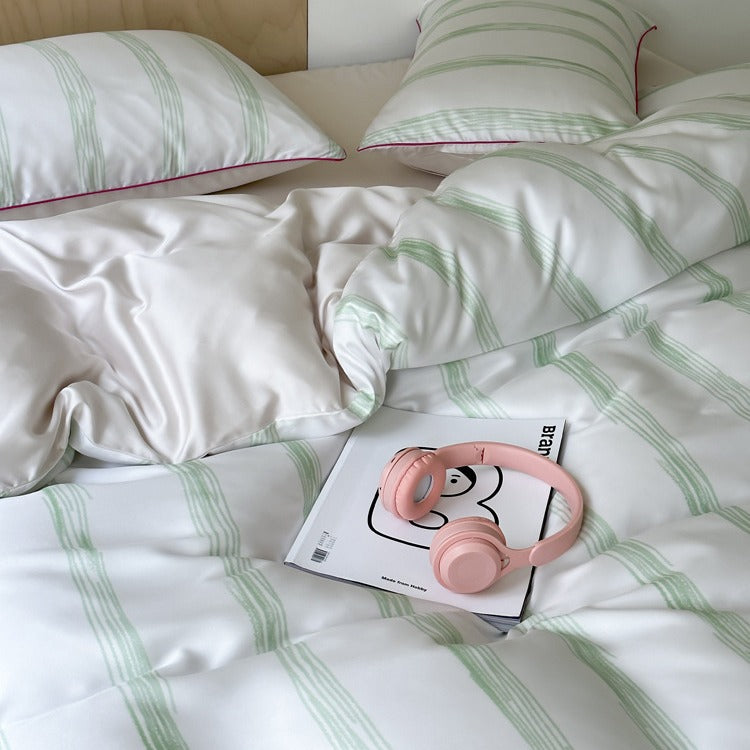 Modern striped bedding set made of cotton satin with hand-drawn stripes and contrasting piping