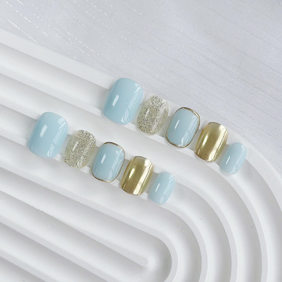 Artistic Press-On Nail Set with Glitter and Metallic Accents