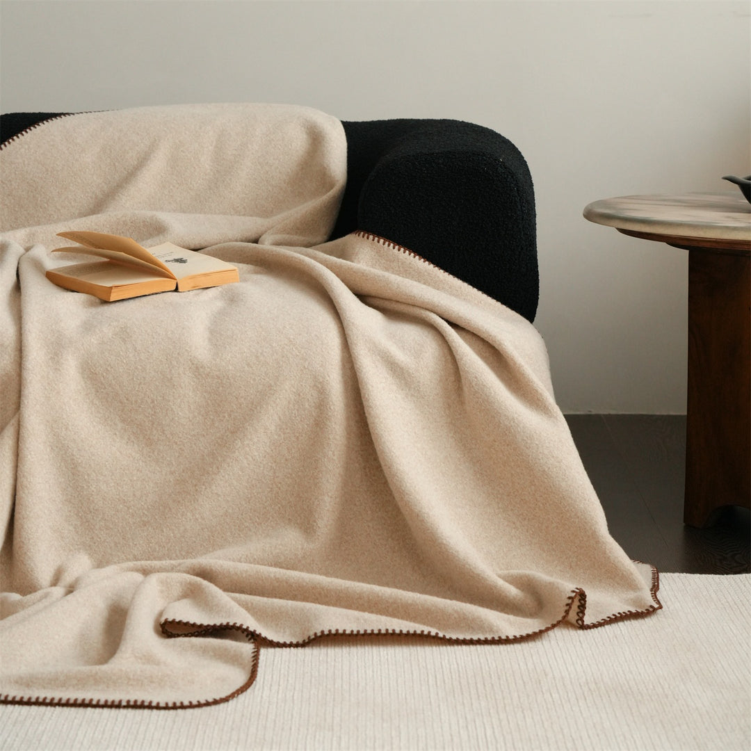 Premium wool blanket with fine hand-stitched edge and particularly soft drape