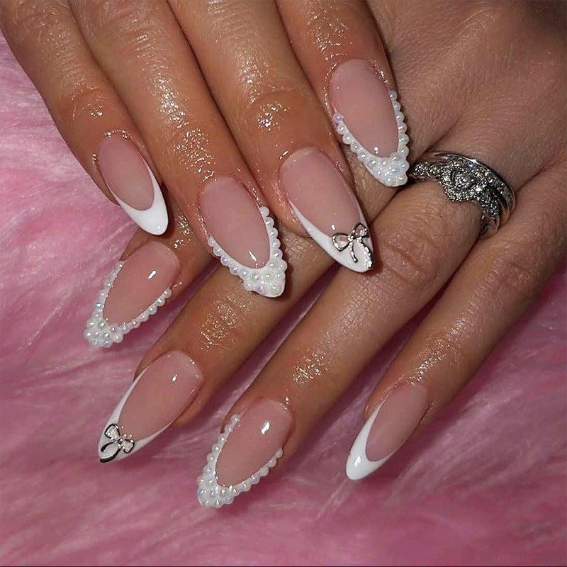 Glamorous artificial nail set with elegant bows and glitter accents Kalsten