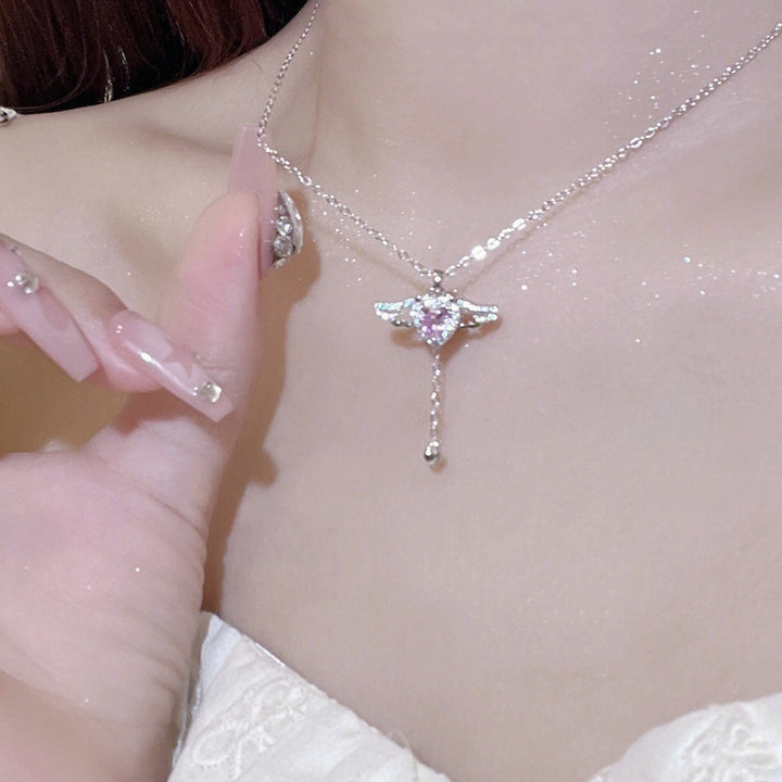 Playful angel neck chain with heart and wings Kalsten