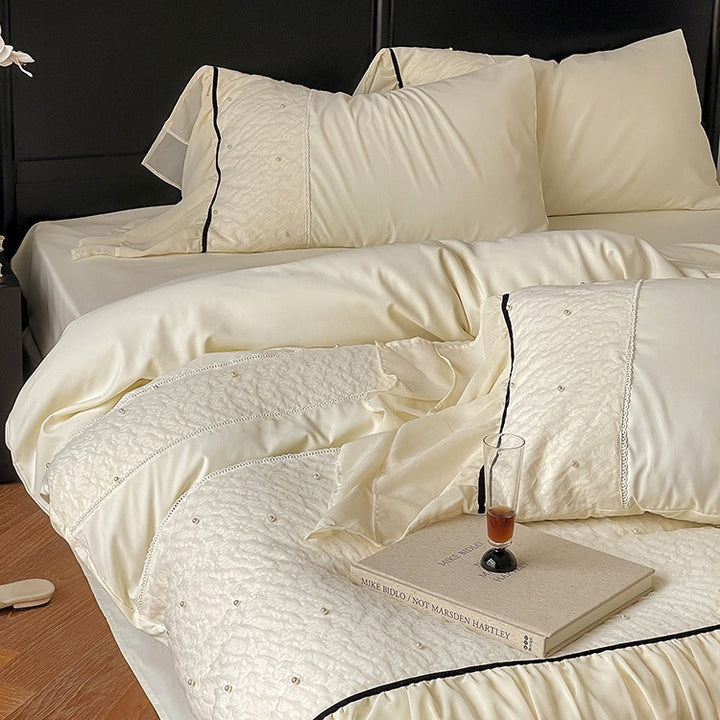 Luxurious bedding set with chiffon ruffles, comforter and contrast piping