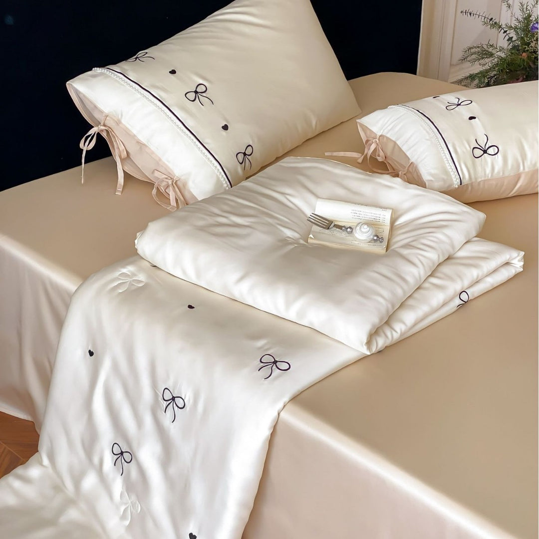 Fine silk look cotton satin bed linen set with delicate ribbon embroidery and ties