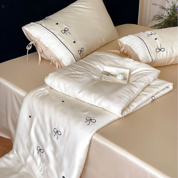 Fine silk look cotton satin bed linen set with delicate ribbon embroidery and ties