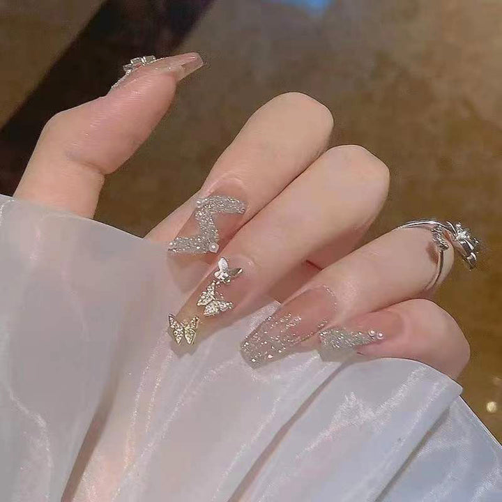 Artificial nails with sparkling rhinestone and bow accents Kalsten