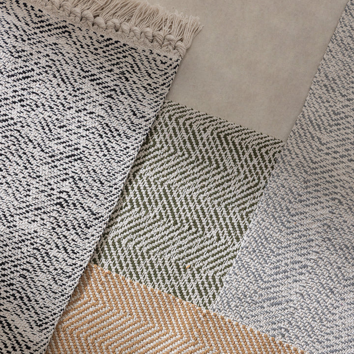 Braided runner rug with herringbone pattern and fringe edge Kalsten