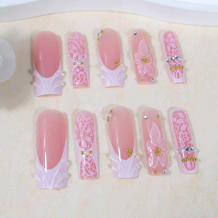 Artificial nail set with floral designs and sparkling accents Kalsten