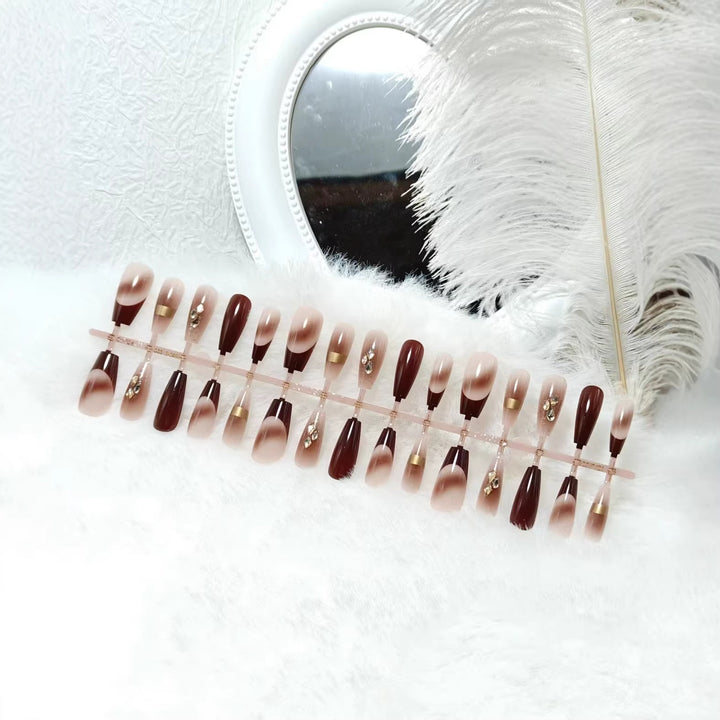 Artificial nails with elegant color gradients and jewelry details Kalsten