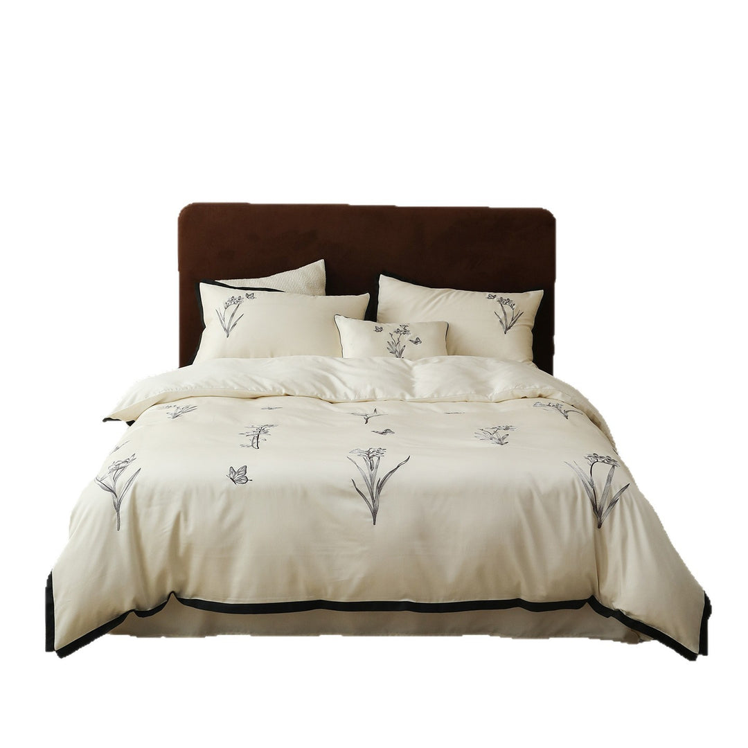 High-quality bedding set made of cotton satin with fine embroidery and black piping