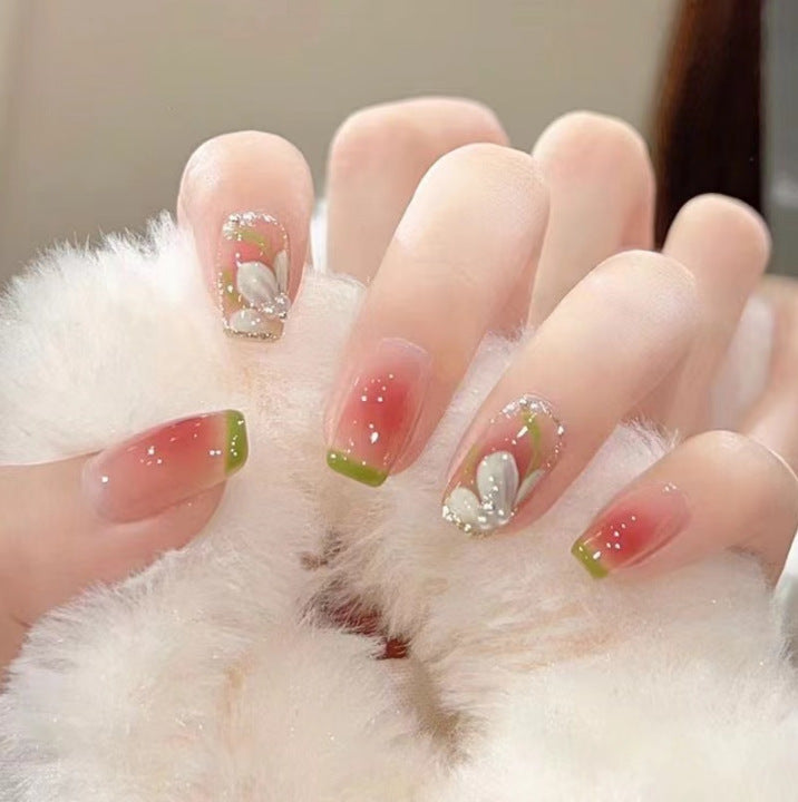Artistic Nail Art with Glitter and Flower Applications Kalsten