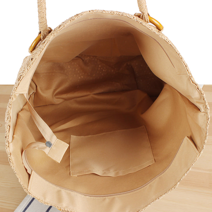Beach bag made of natural woven material with sturdy carry handles Kalsten