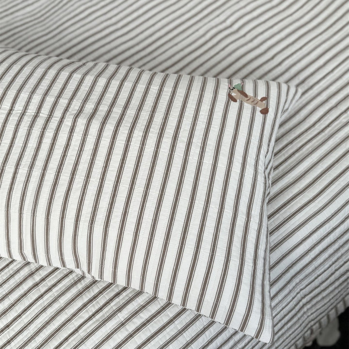 Quilted cotton bedspread with fine striped texture and cherry embroidery