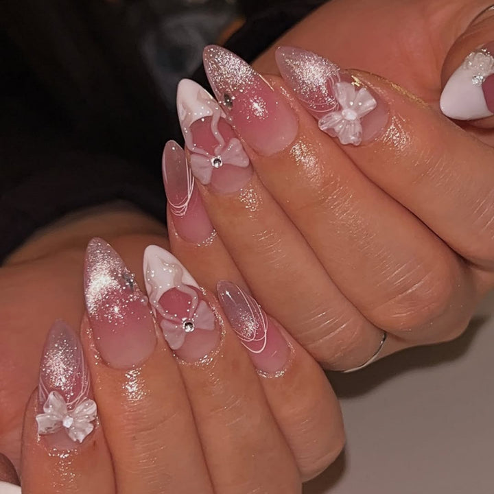Artful acrylic nails with floral design and glitter embellishment Kalsten