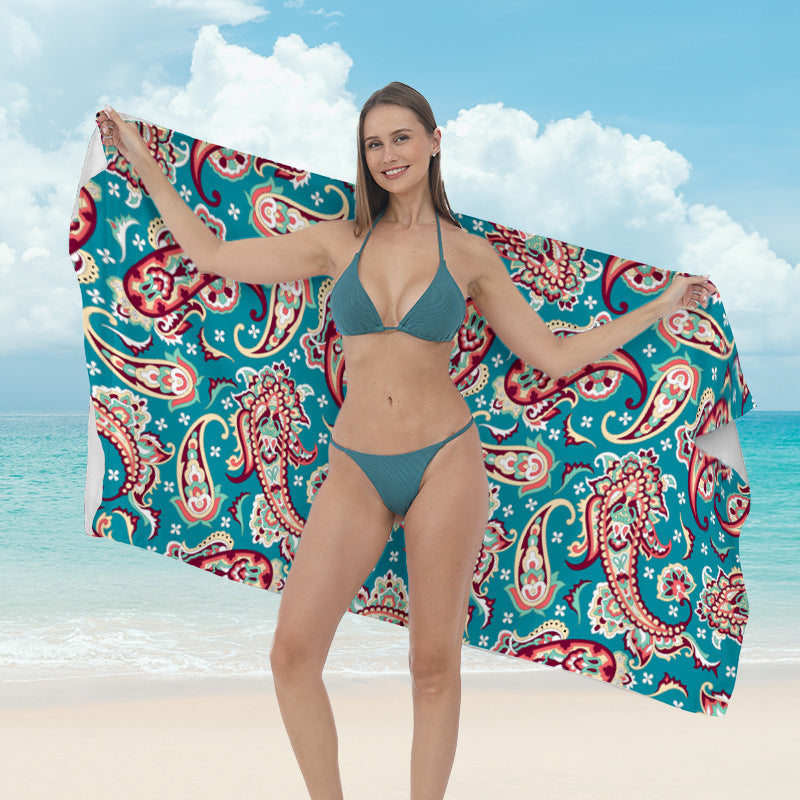 Beach towel with vibrant tropical plant motif Kalsten