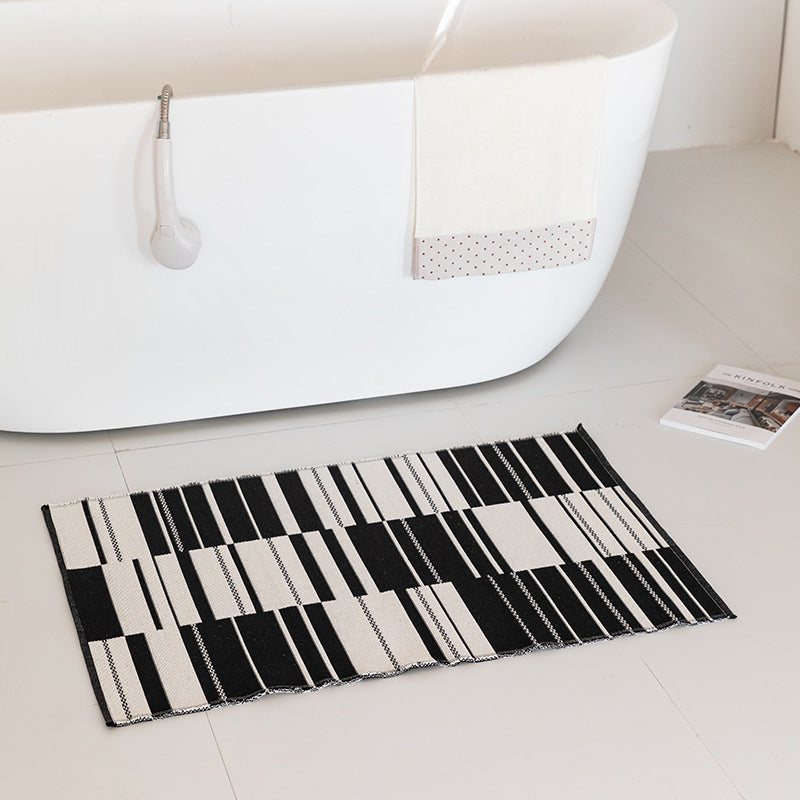 Flat-woven bath mat with abstract geometric pattern Kalsten