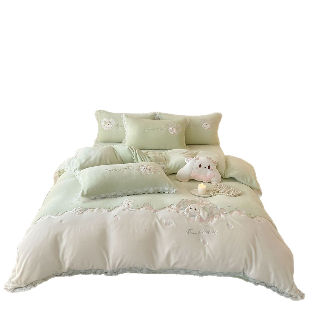 Romantic children's bedding set with embroidered bunny appliqués and lace ruffle