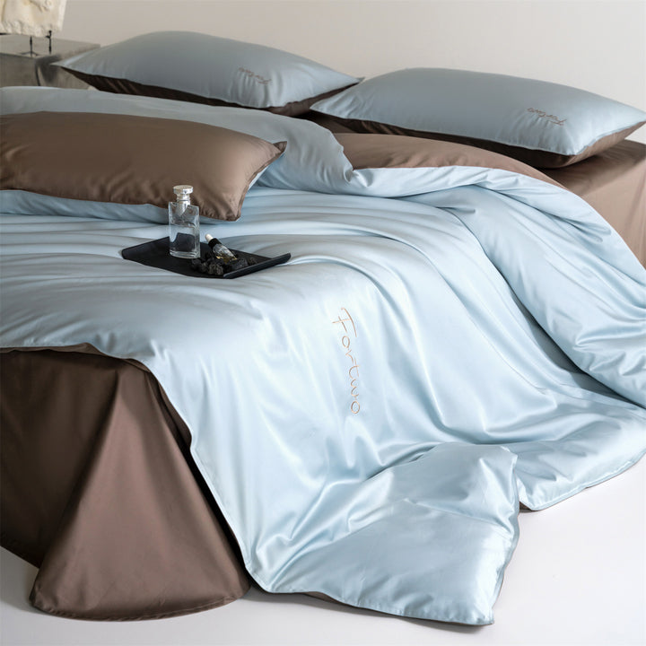 Reversible satin bedding set with fine tone-on-tone embroidery