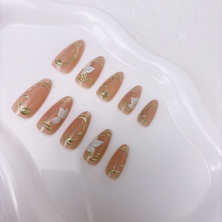 Elegant artificial nails with marble and gold accents Kalsten