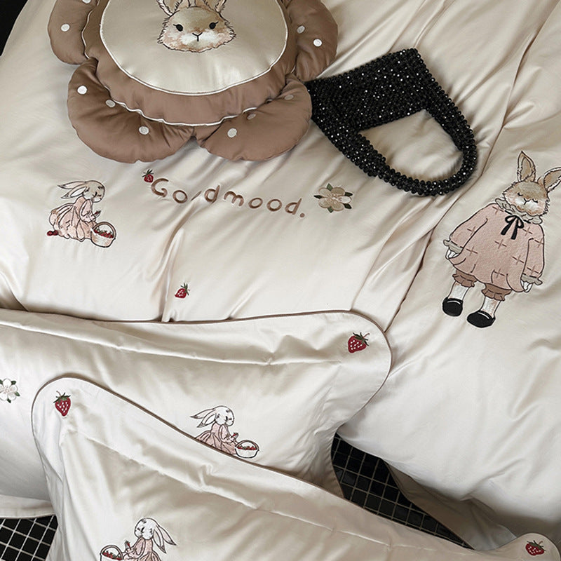 Fine cotton satin bedding set with elaborate bunny embroidery and piped edge