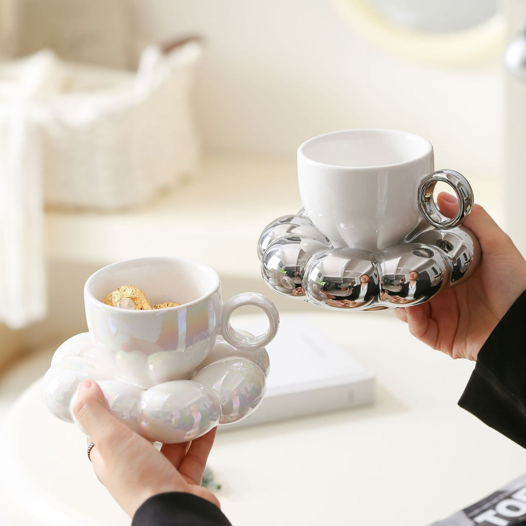 Ceramic mug with sculptural bubble saucer