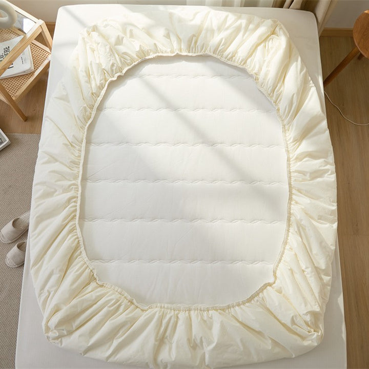 Breathable climate-regulating topper with hollow fiber filling and elastic all-round rubber