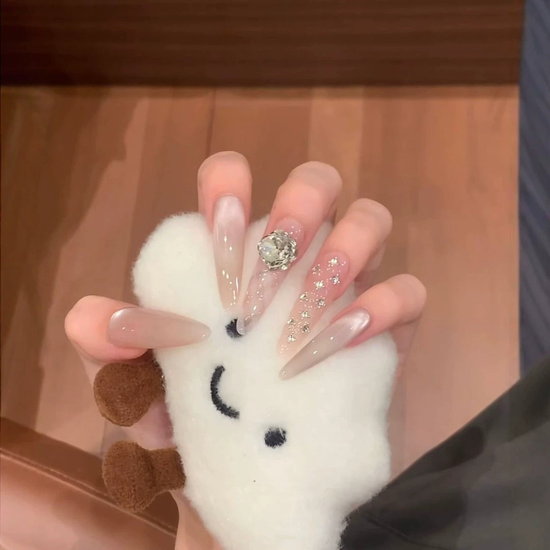 Glamorous Stiletto Nail Extensions with Glitter Accents