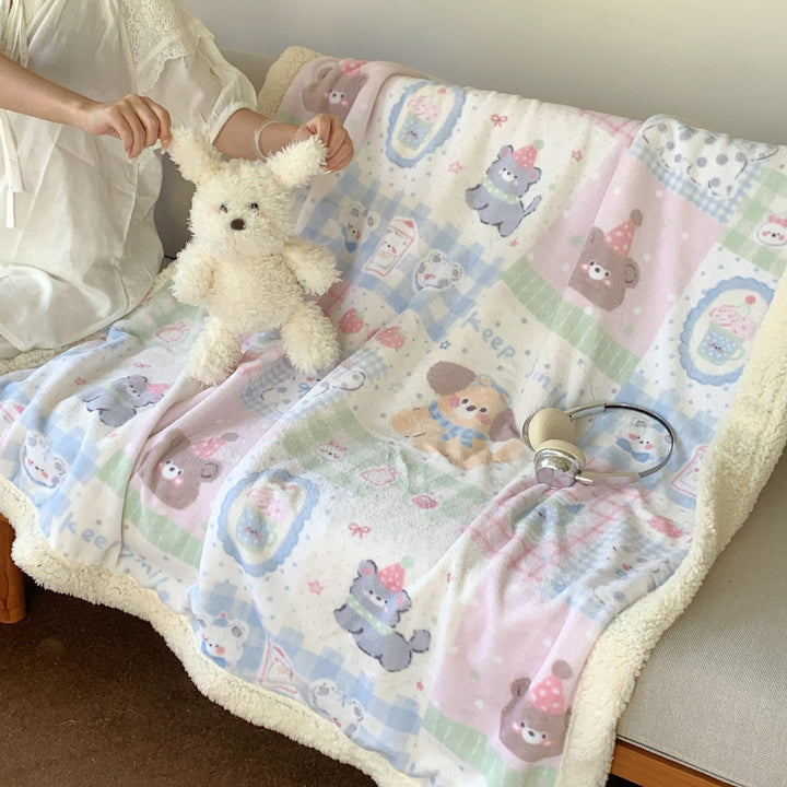 Reversible fleece blanket with cartoon cat design and teddy lining