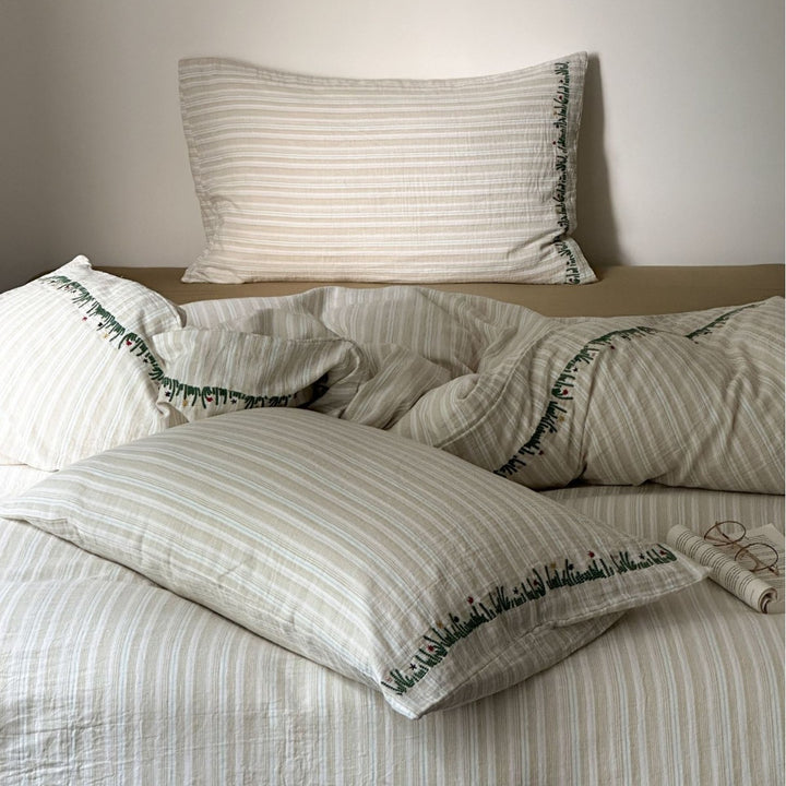 Cotton duvet cover set with fine pinstripes and subtle embroidery applications