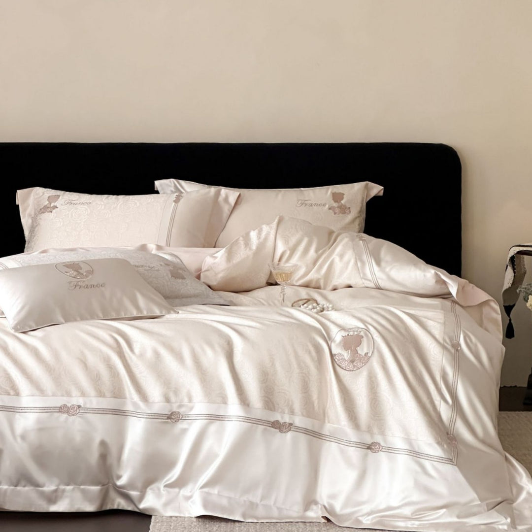Luxurious cotton satin bed linen set with jacquard rose pattern and embroidered silhouette applications
