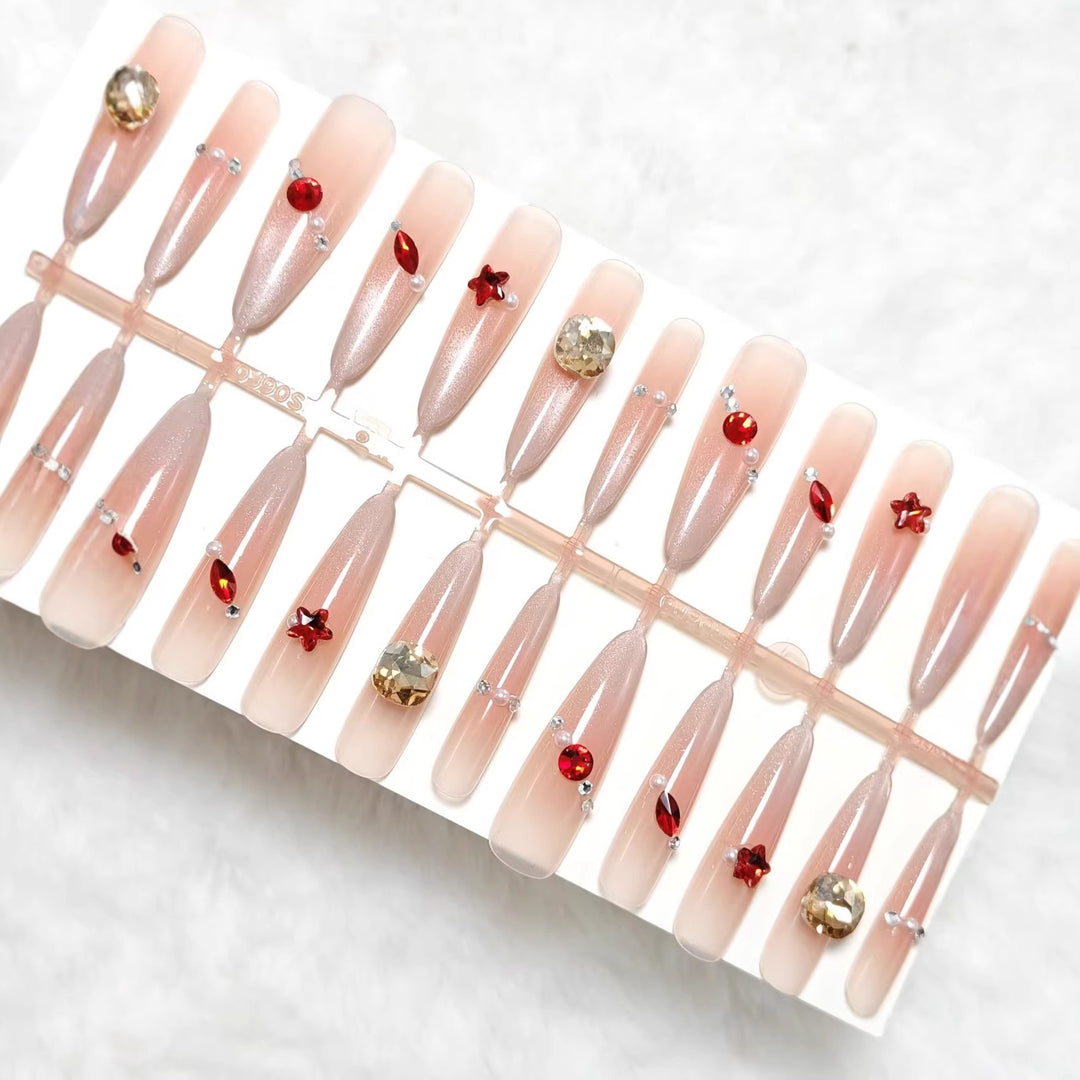 Glamorous artificial nails with shimmering embellishments Kalsten