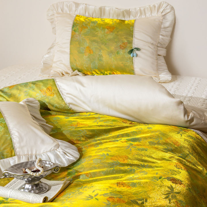 Bedding set with ruffles, satin trim and floral center panel