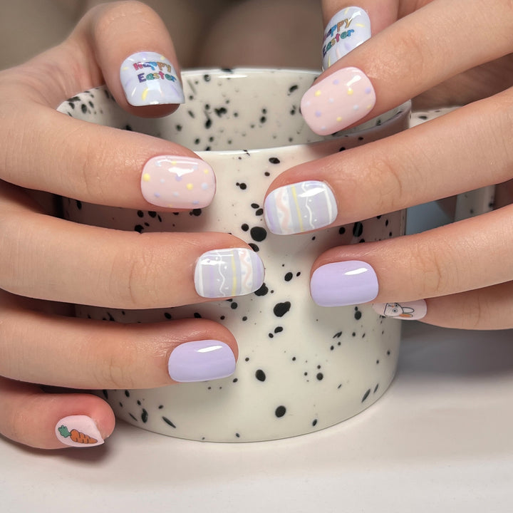 Artful nail art with cute animal motifs and pastel-colored design Kalsten