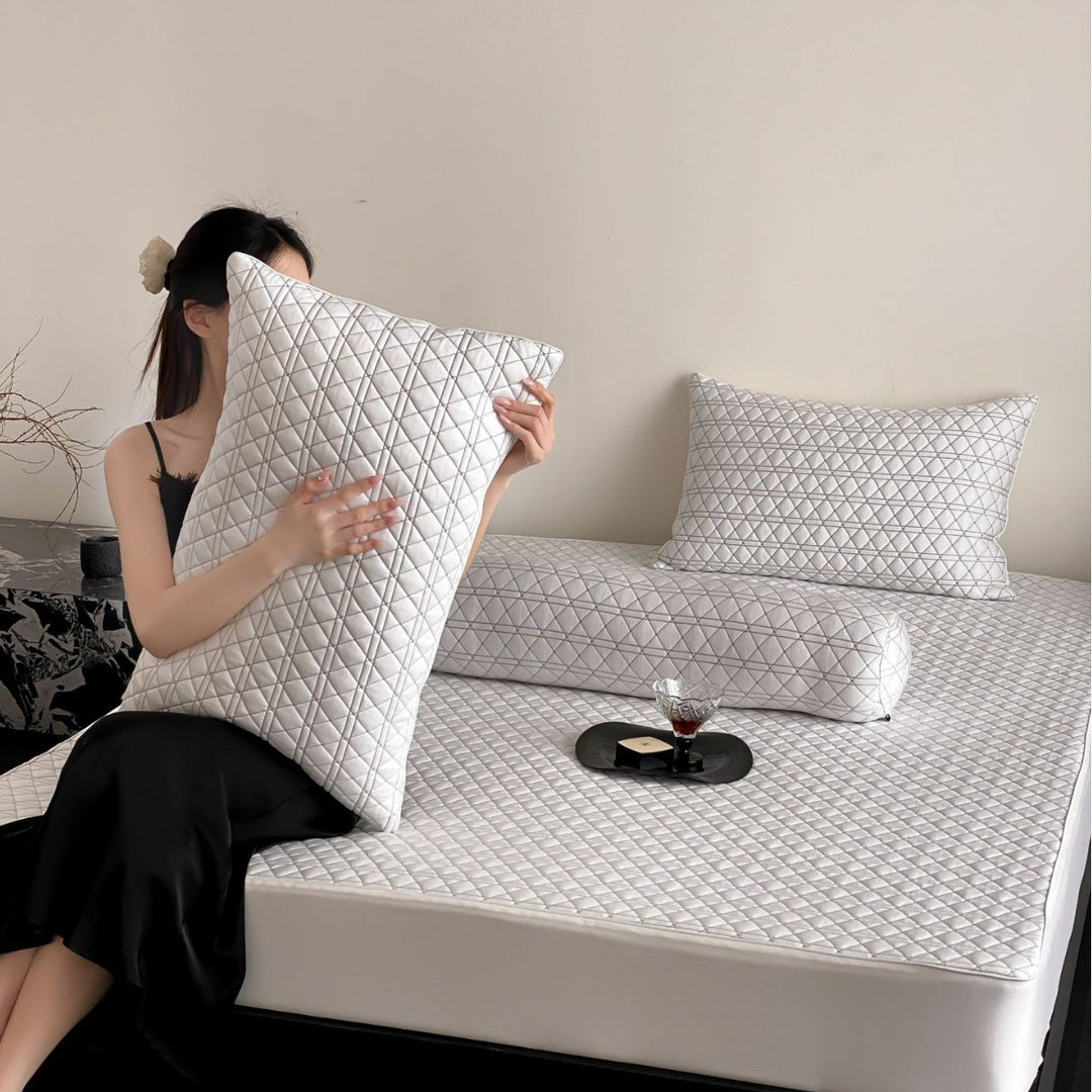 Quilted bedspread set with ginkgo leaf relief, ruffled bed skirt and pillowcases