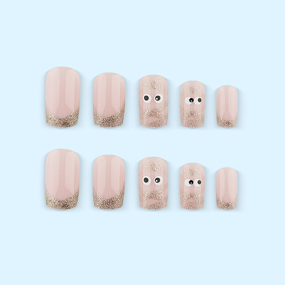 Artificials nails with playful eye design and glitter tips Kalsten