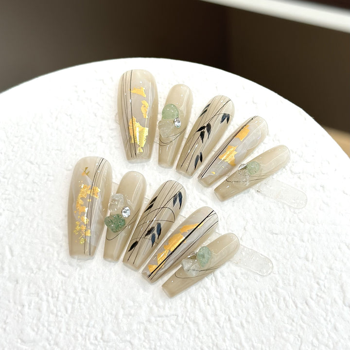 Decorative Press-On Nail Set with Artistic Accents