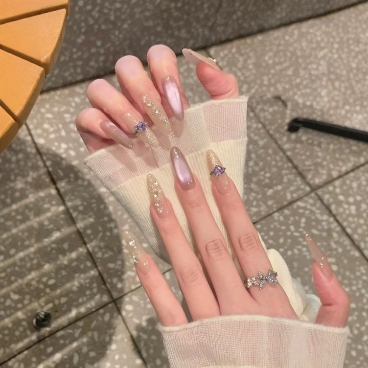 Elegant Long Stiletto Nail Extensions with Gem Accents