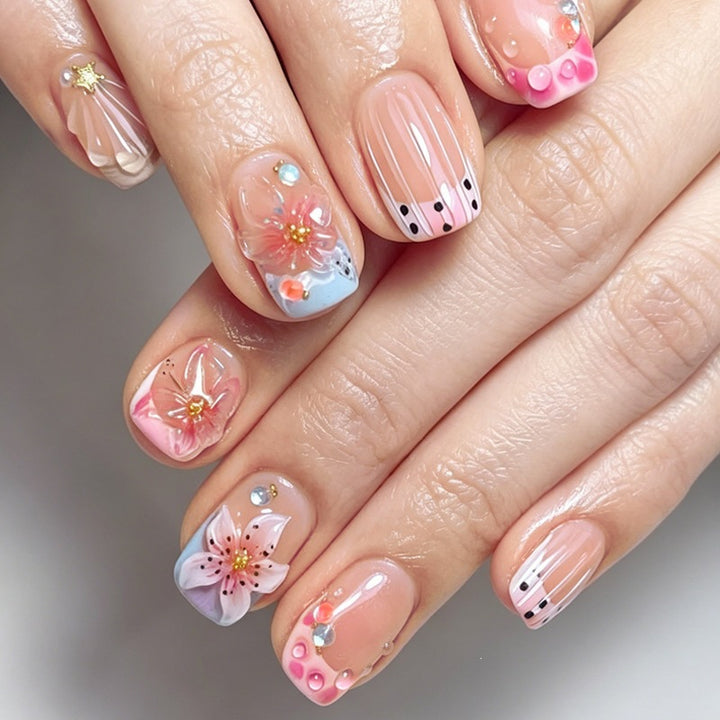 Artificial nail set with floral designs and elegant glitter elements Kalsten