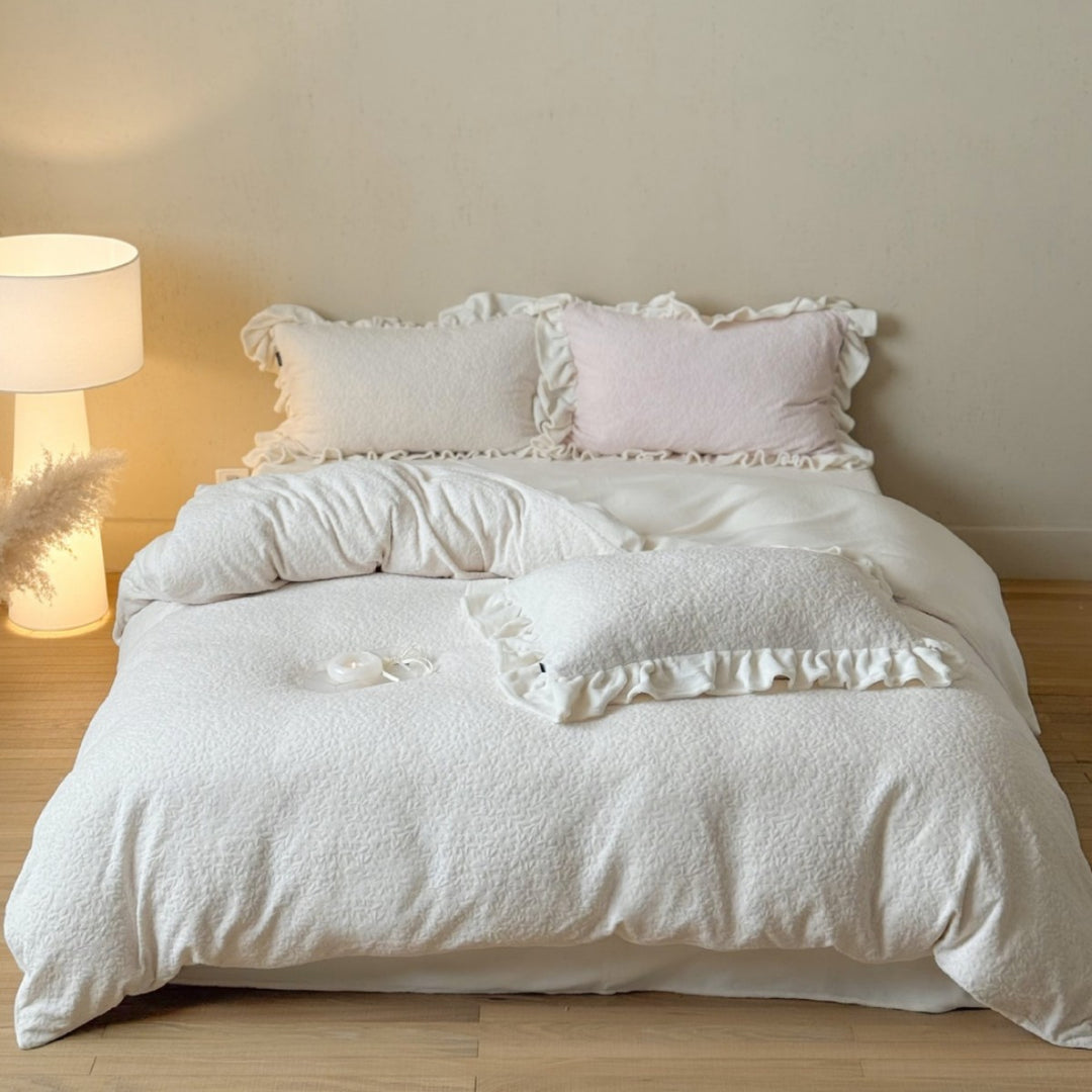 Bedding set with ruffle border and textured cotton blend