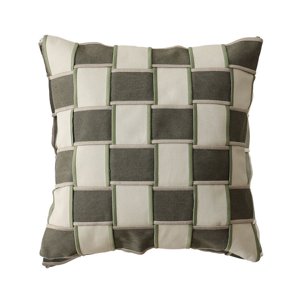 woven decorative pillow with braided square pattern