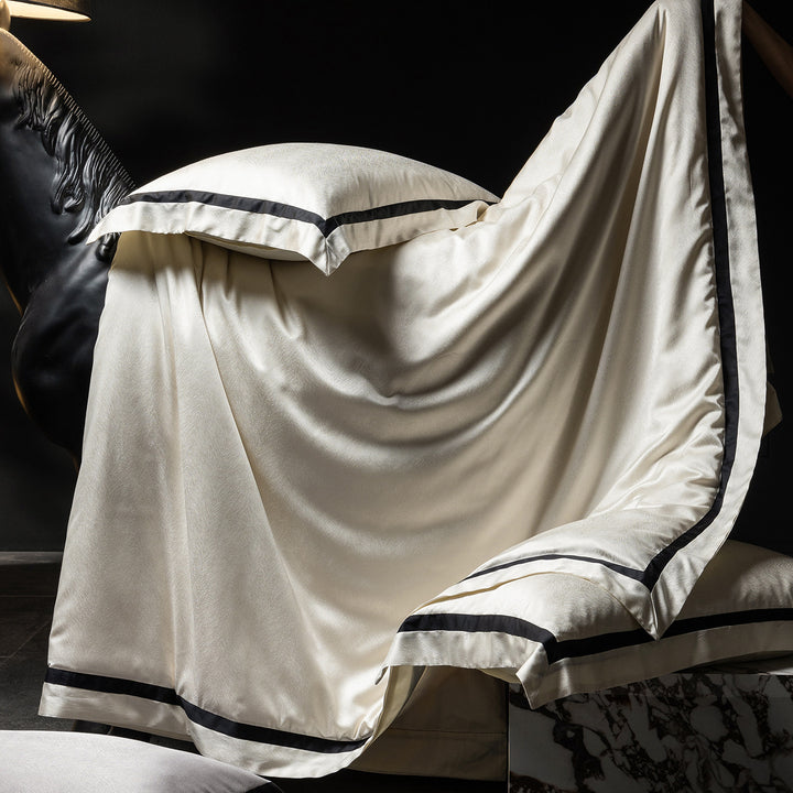 Luxurious satin bedding set with contrasting decorative trim