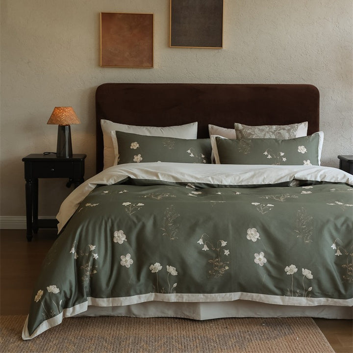 Cotton satin bedding set with subtle botanical print and contrasting hem edge