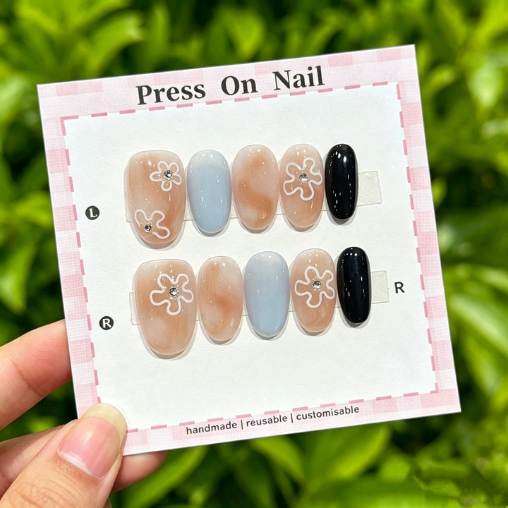 Artistic Press-On Nail Set with Floral and Graphic Designs